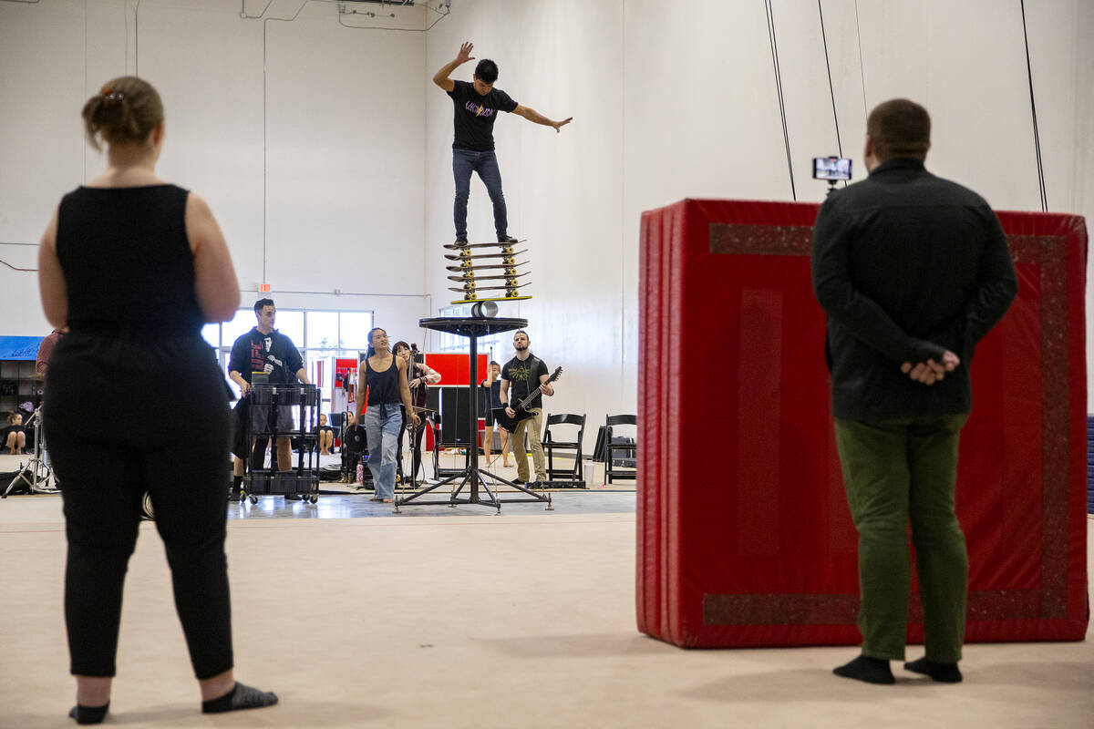 Jonathan Rinny practices his balancing stunt during rehearsal for IGNITE at Nevada Rhythmic Aca ...