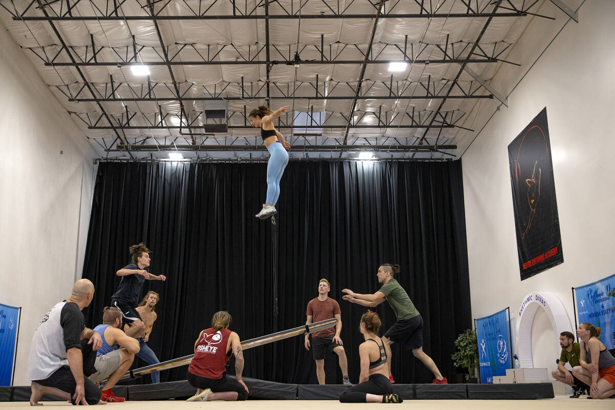 Teeterboard performer Rebekah Bubnar is catapulted into the air during rehearsal for IGNITE at ...