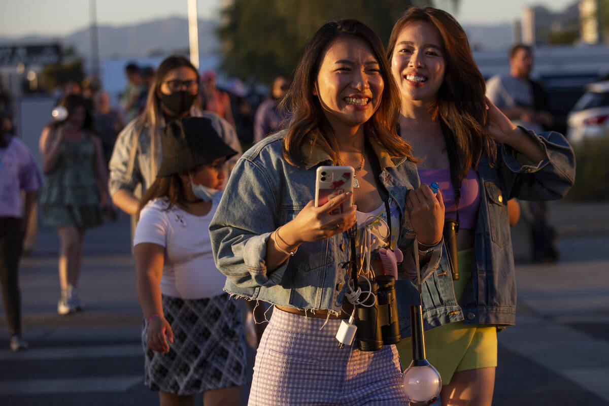 Aiko Watanabe, center, and Saki Kumei, who traveled from Japan for the opening night of BTS&#x2 ...
