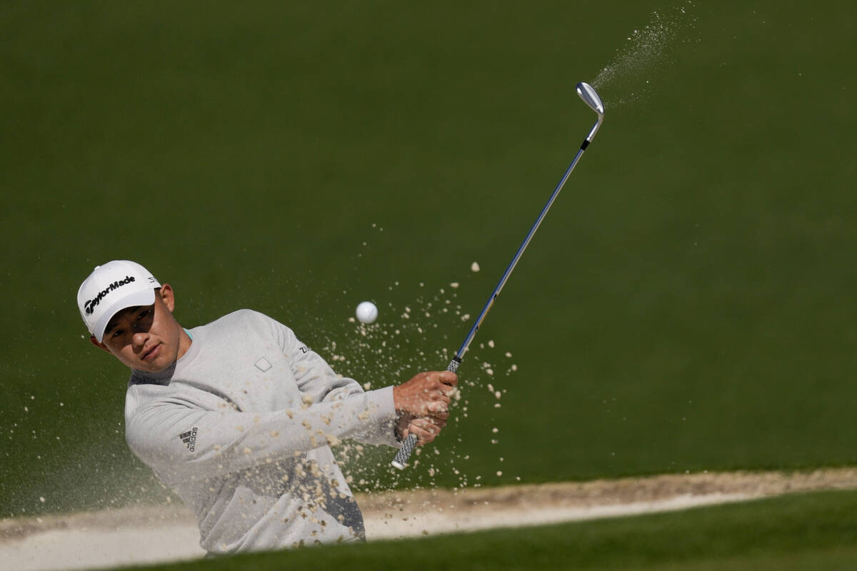 Collin Morikawa hits out of a bunker on the second hole during the second round at the Masters ...