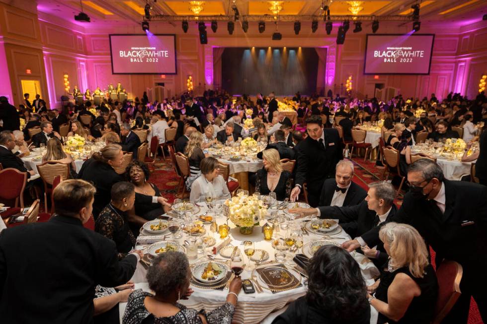 Guests are served dinner during Nevada Ballet Theatre’s 38th Annual Black & White Ba ...