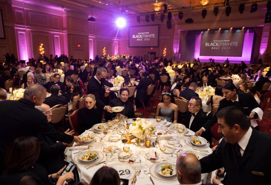 Guests are served dinner during Nevada Ballet Theatre’s 38th Annual Black & White Ba ...