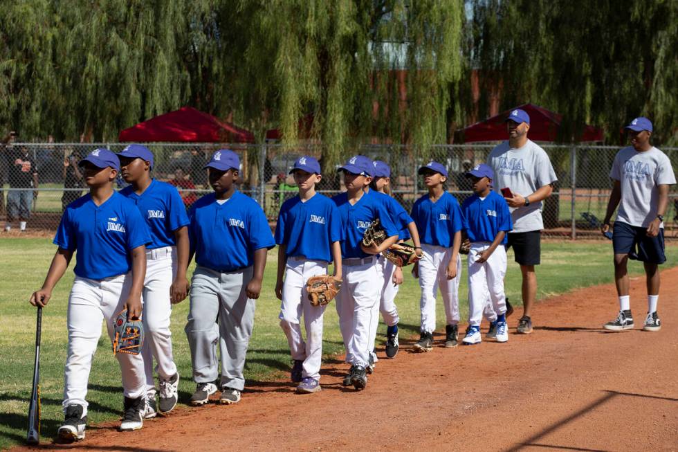Bolden Little League players take the field before the first game of their sixth season at Dool ...