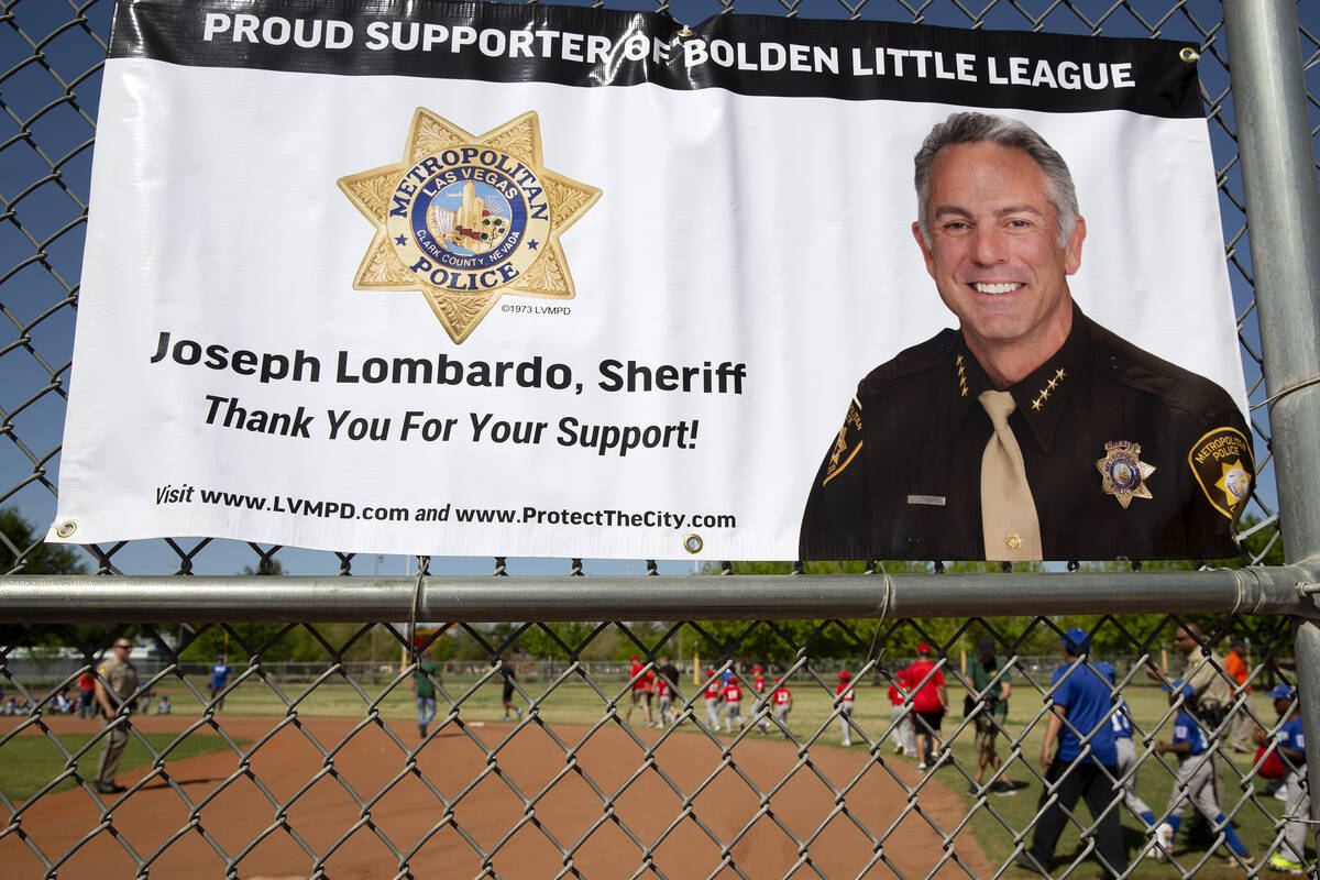 Players take the field before Sheriff Joe Lombardo throws the first pitch at Bolden Little Leag ...