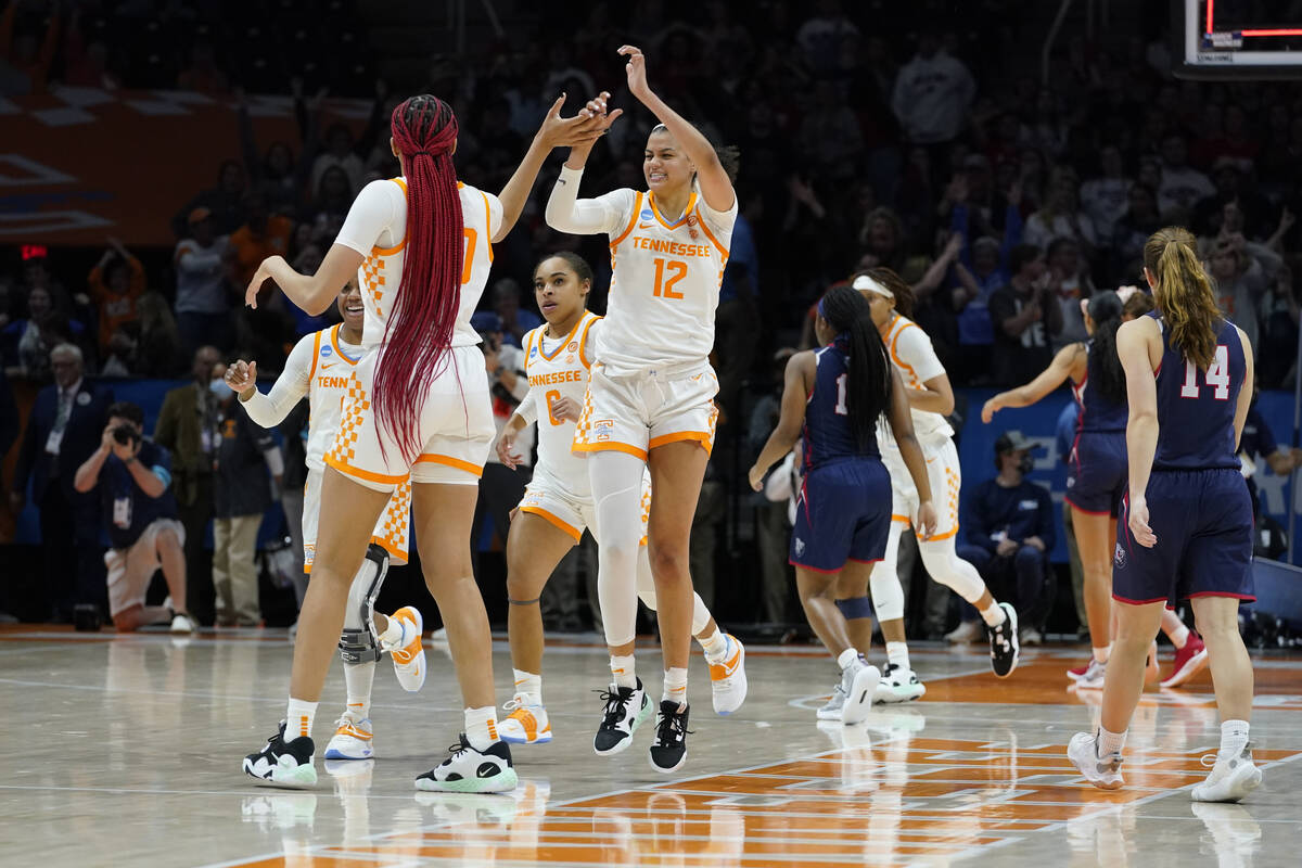 Tennessee's Rae Burrell (12) celebrates with Tamari Key (20) after Tennessee beat Belmont 70-67 ...