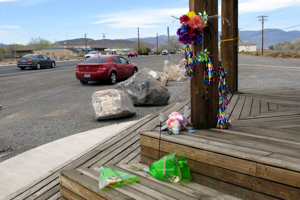 Items are left at a makeshift memorial Friday, April 8, 2022, along the main street in Fernley, ...