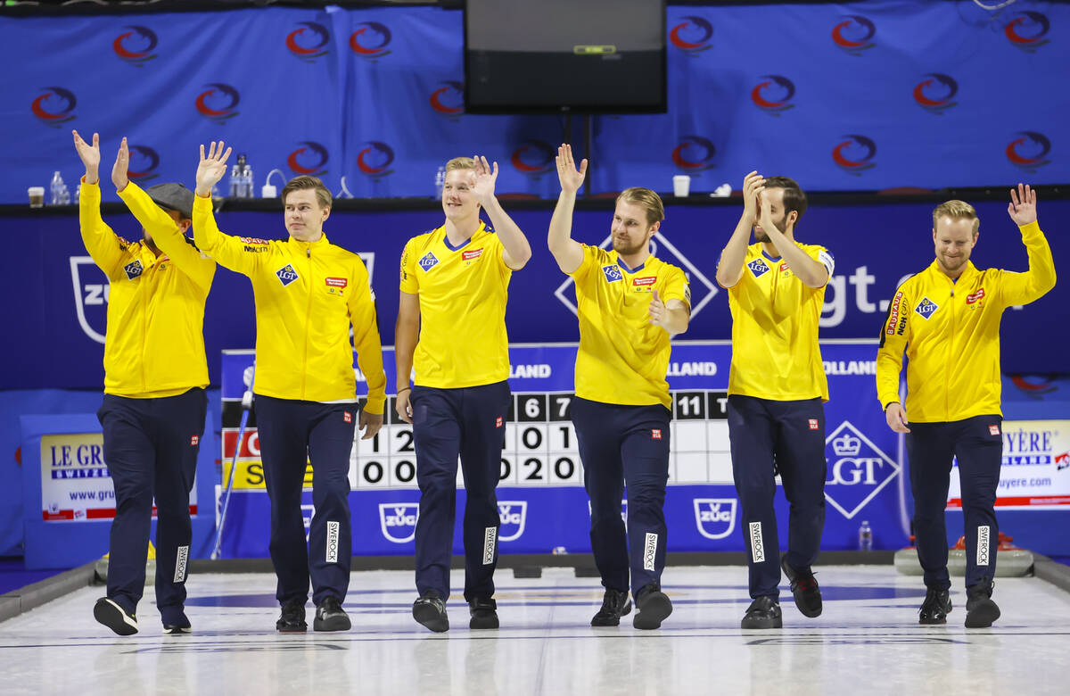 Sweden’s national team celebrates after defeating Canada in the gold medal game of the L ...