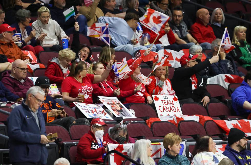 Canada fans cheer during the LGT World Men's Curling Championship final at the Orleans Arena on ...