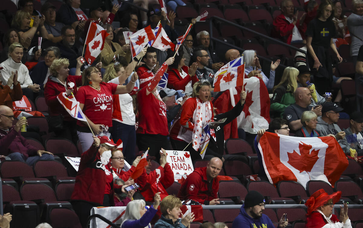 Canada fans cheer at the start of the gold medal game against Sweden in the LGT World Men's Cur ...