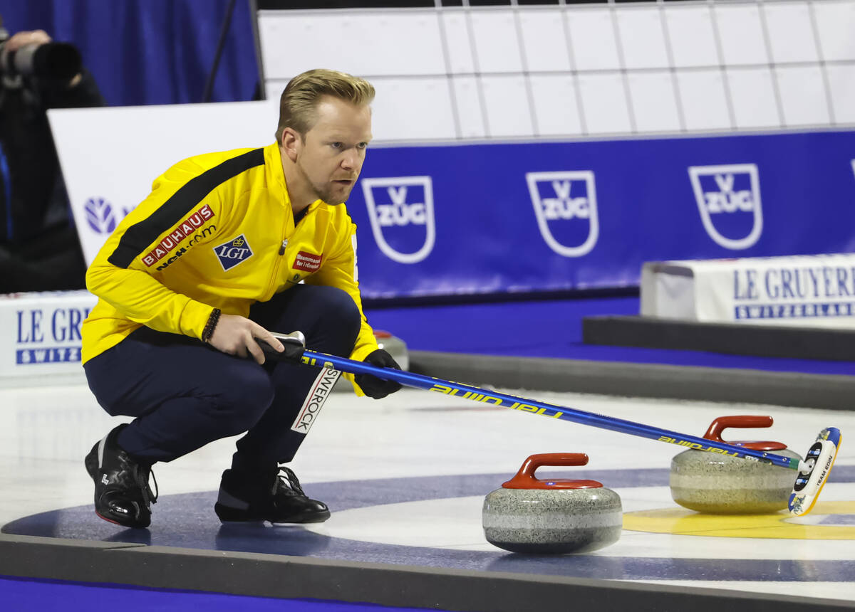 Sweden skip Niklas Edin keeps an eye on the stone while competing against Canada in the gold me ...
