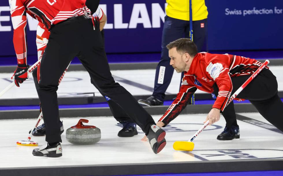 Canada skip Brad Gushue delivers a stone against Sweden in the gold medal game of the LGT World ...