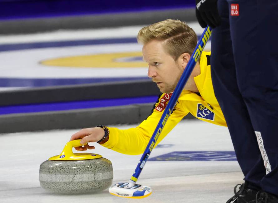 Sweden skip Niklas Edin delivers a stone against Canada in the gold medal game of the LGT World ...