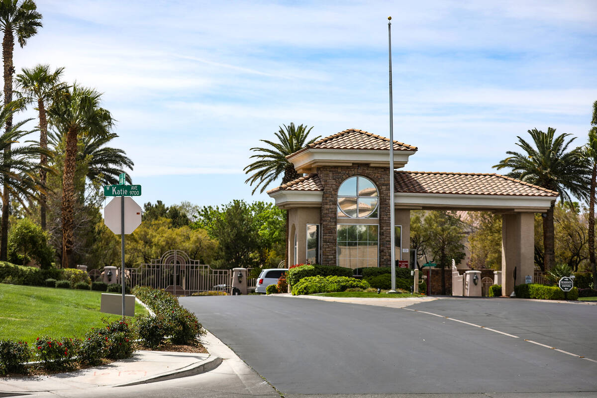 The entrance to a gated community where an armed teen was shot by a person walking their dog du ...