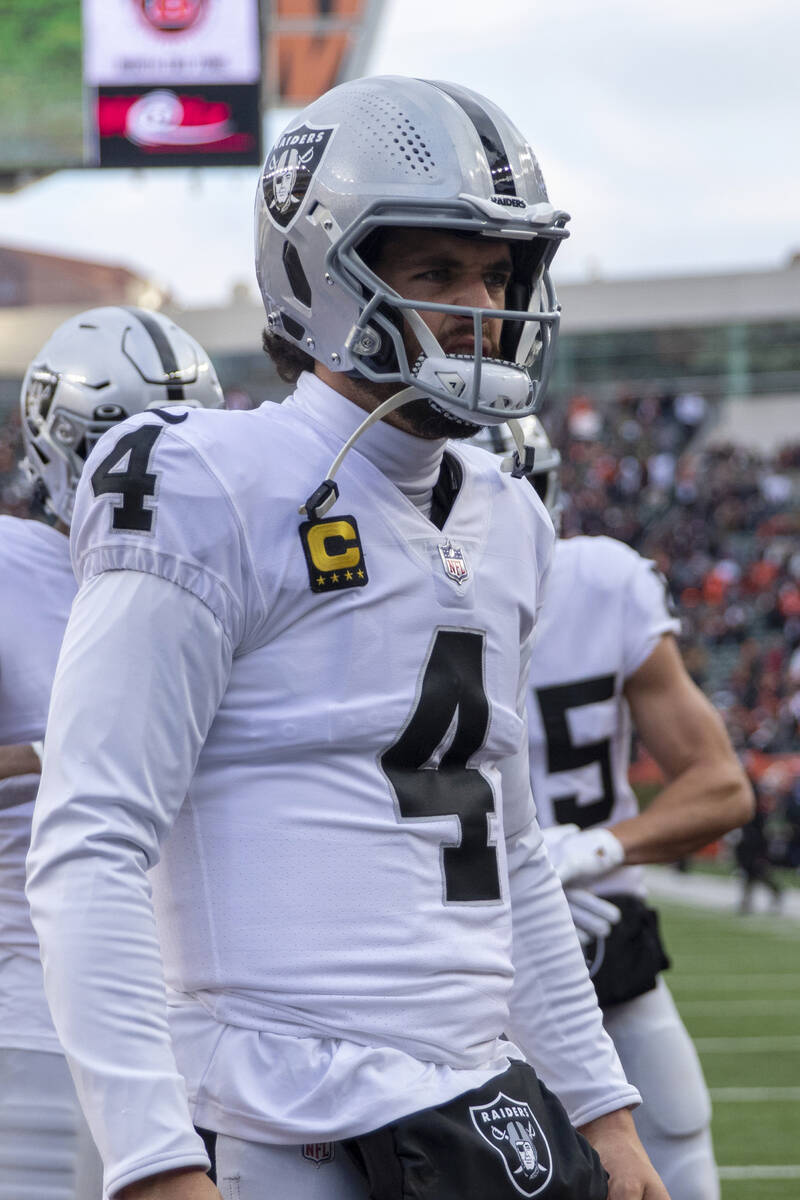 Raiders quarterback Derek Carr (4) on the field before an NFL playoff game against the Cincinna ...