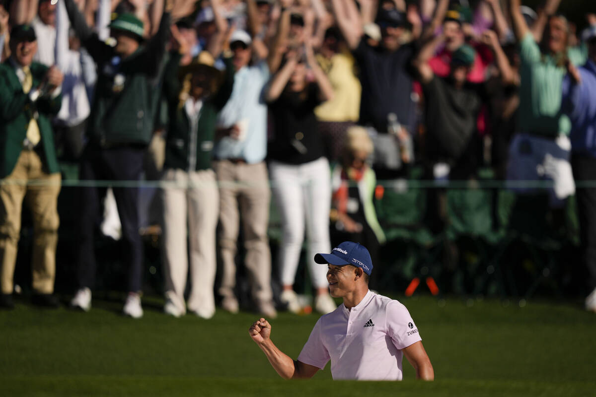 Collin Morikawa celebrates after holing out on the 18th hole for a birdie during the final roun ...