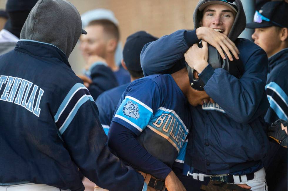 Centennial teammates celebrate with Alex Rhynes (6) after Rhynes scored during a boys high scho ...