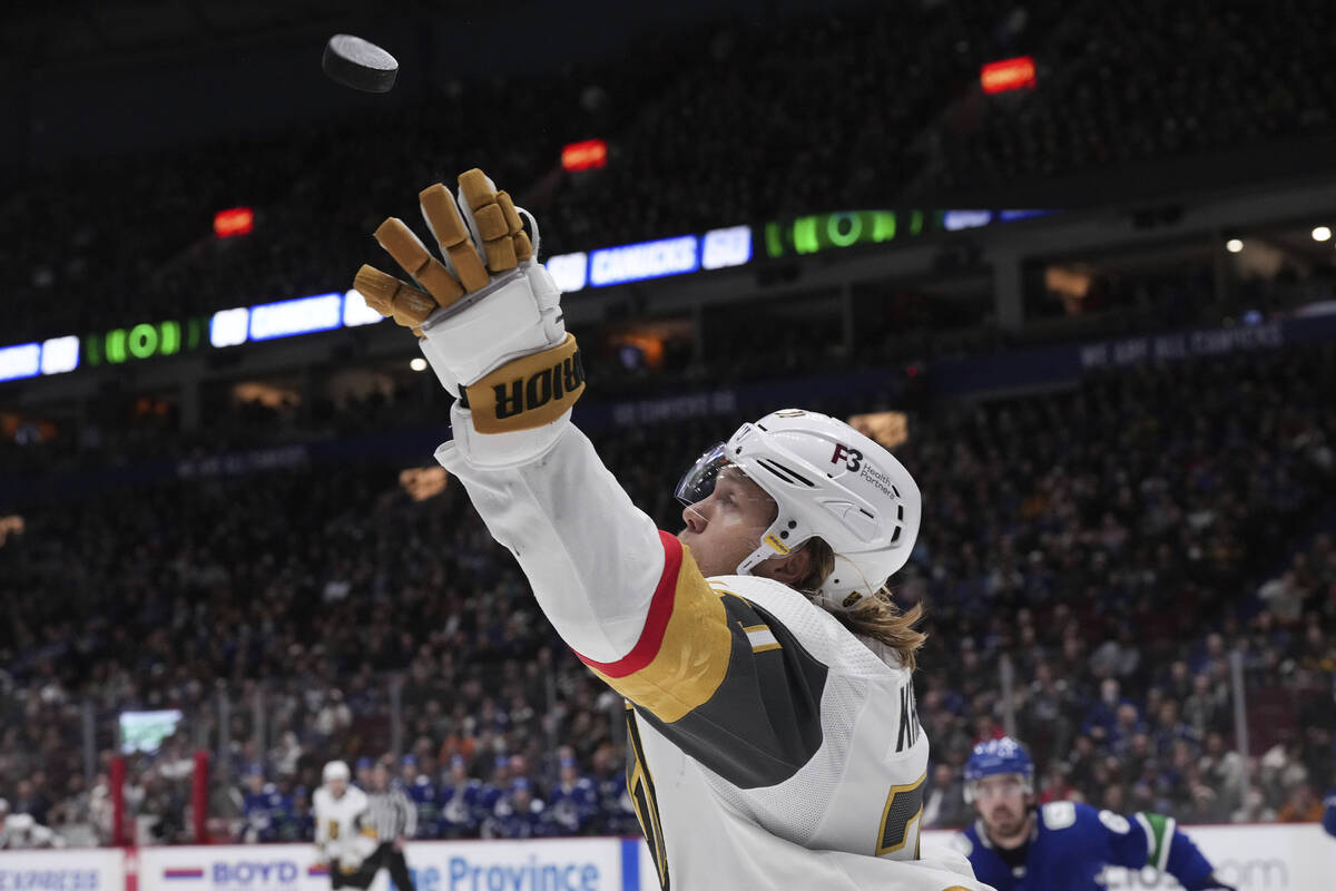 Vegas Golden Knights' William Karlsson grabs the puck out of the air during the third period of ...