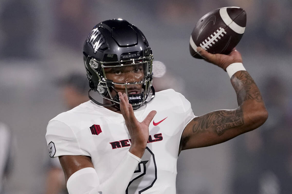 UNLV quarterback Doug Brumfield (2) warms up prior to an NCAA college football game against Ari ...