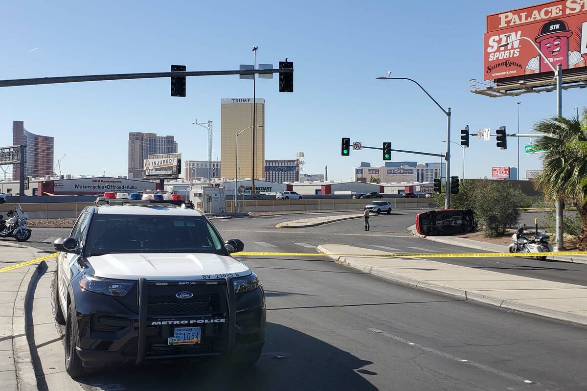 Police investigate a rollover crash on Rancho Drive near Teddy Drive, Wednesday, April 13, 2022 ...