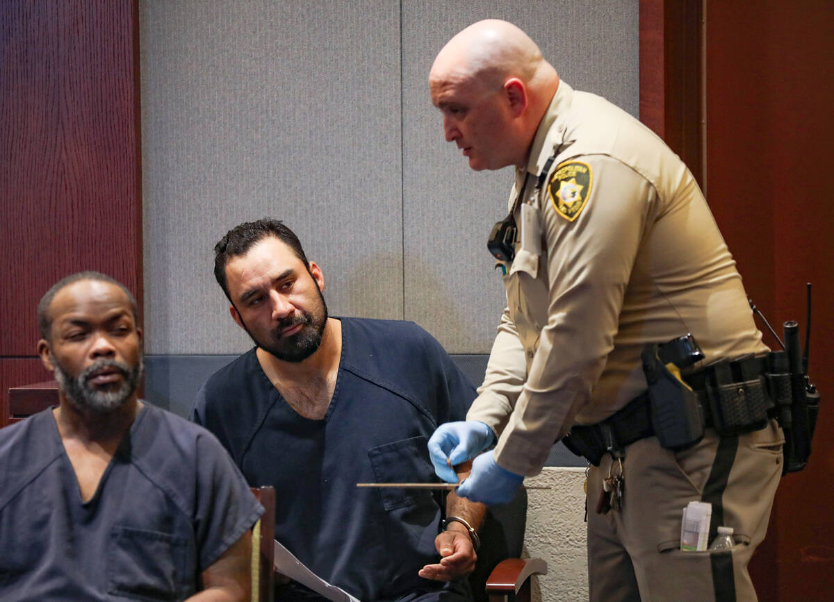Jesus Nevarez, center, a murder suspect in a random shooting on Saturday, appears in court for ...