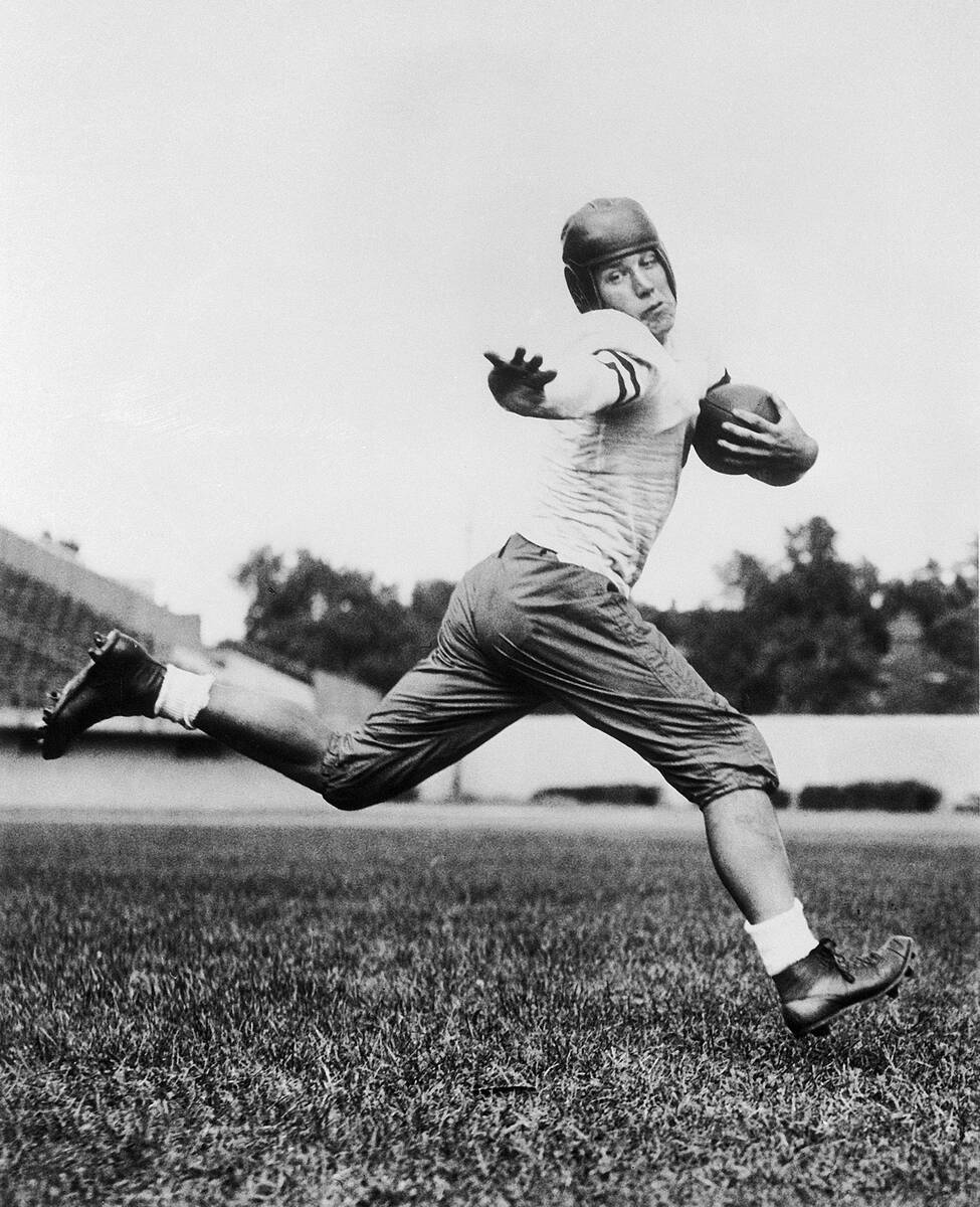 In this 1934 file photo, University of Chicago halfback Jay Berwanger is shown in the action po ...