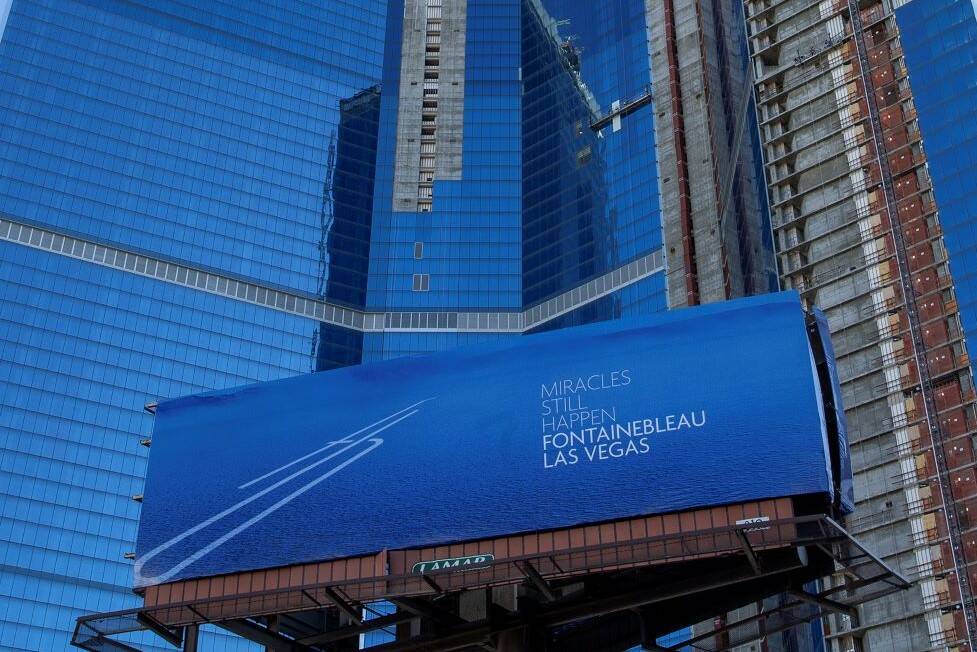 A new billboard for Fontainebleau Las Vegas that declares "Miracles still happen,” next to th ...