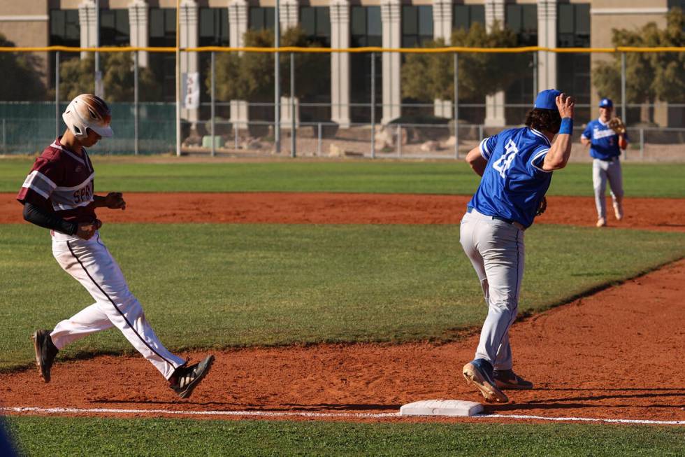 Bishop Gorman first baseman Easton Shelton (28) throws the ball after making a catch to put out ...