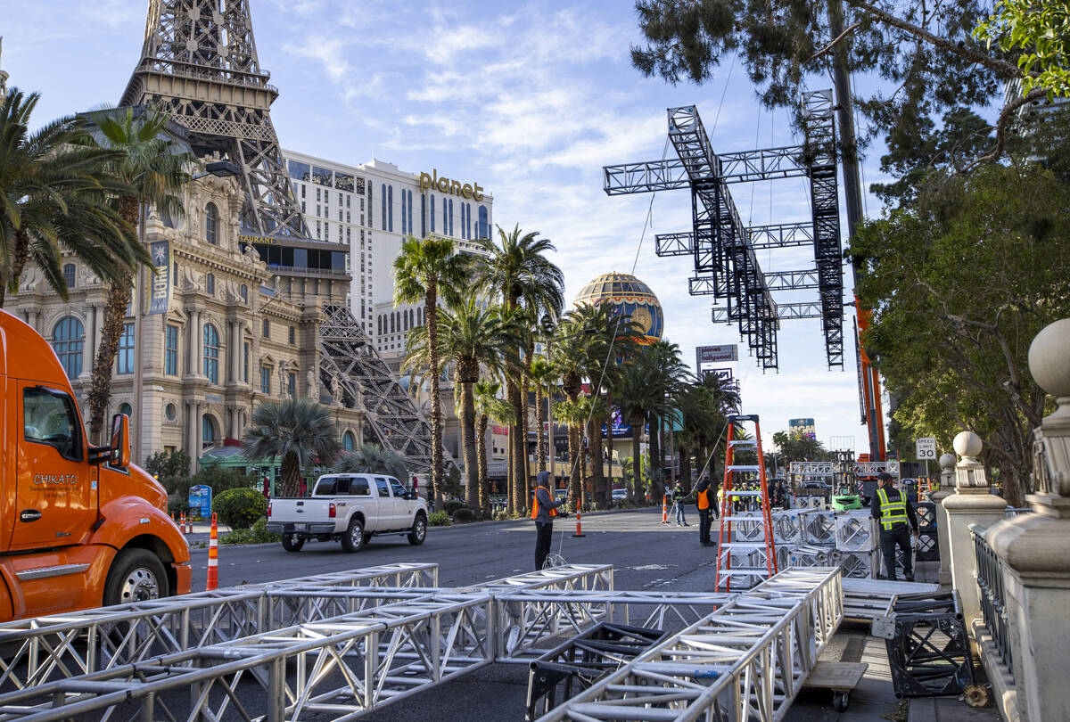 The second piece for the NFL Draft red carpet stage is lifted to clear the trees then into plac ...