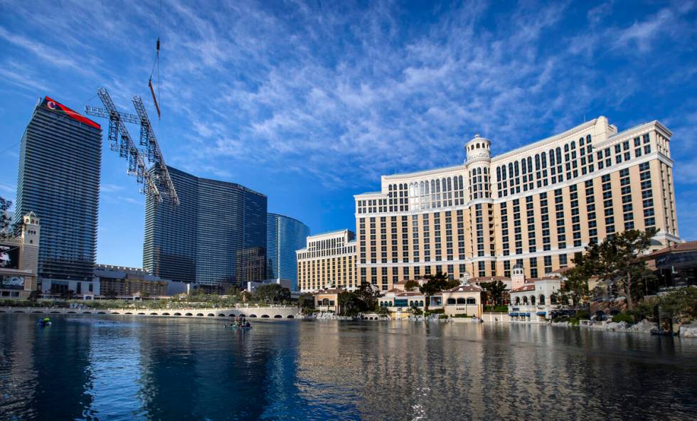The second piece for the NFL Draft red carpet stage is lowered onto the water at the Bellagio F ...