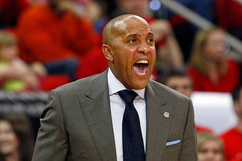 Miami (Ohio) coach John Cooper calls to his players during the first half of an NCAA college ba ...