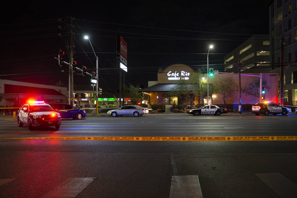 Metropolitan police investigate a homicide at 4680 South Maryland Parkway, across from the UNLV ...