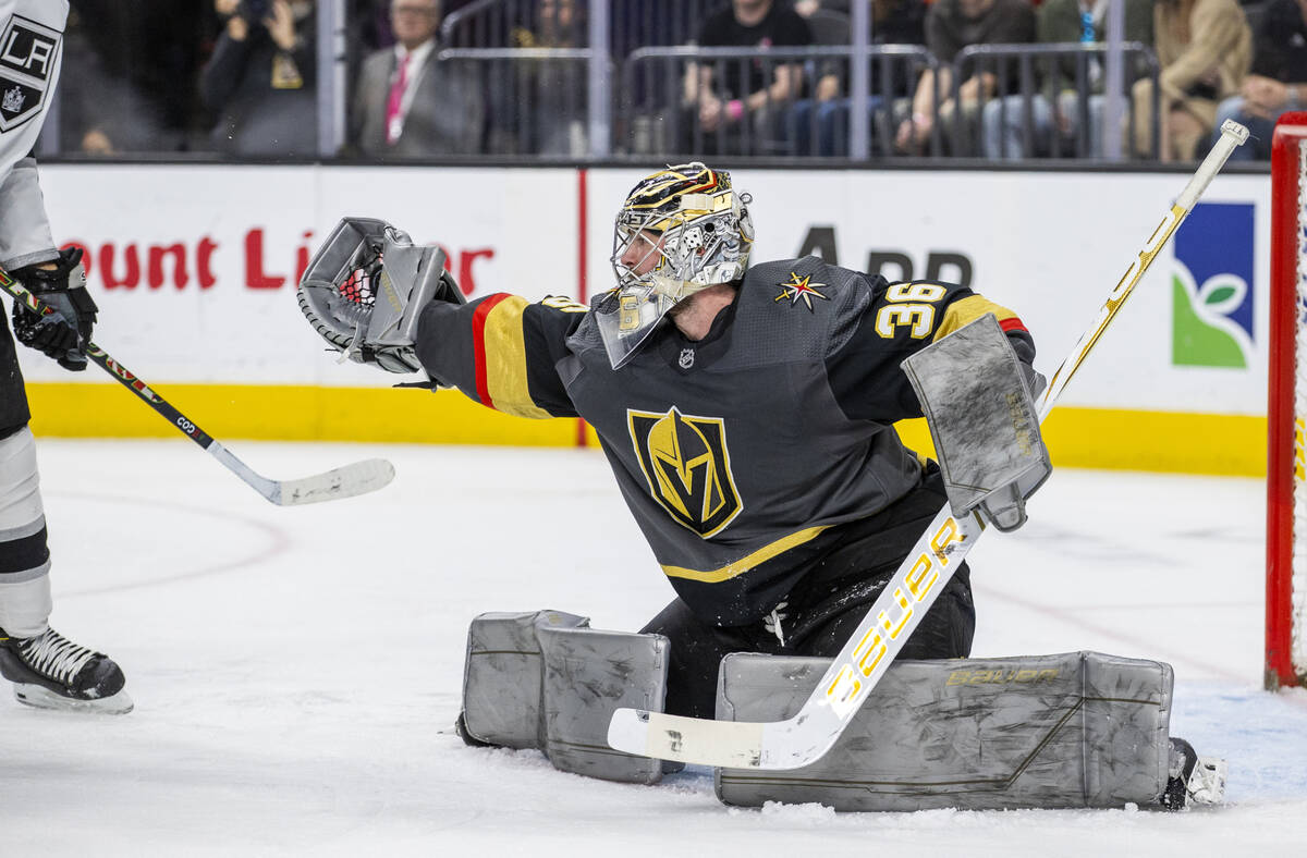 Golden Knights goaltender Logan Thompson (36) snags a puck shot by the Los Angeles Kings during ...