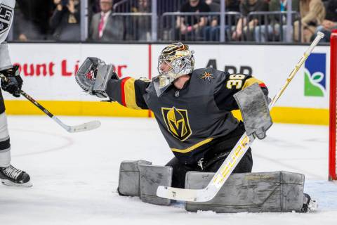 Golden Knights goaltender Logan Thompson (36) snags a puck shot by the Los Angeles Kings during ...