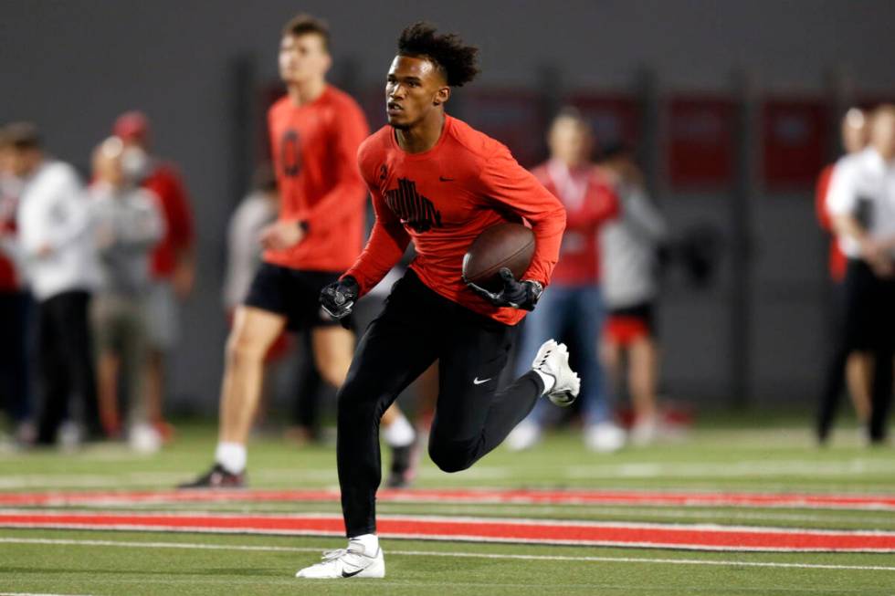 Wide receiver Garrett Wilson runs a football drill during Ohio State Pro Day in Columbus, Ohio, ...