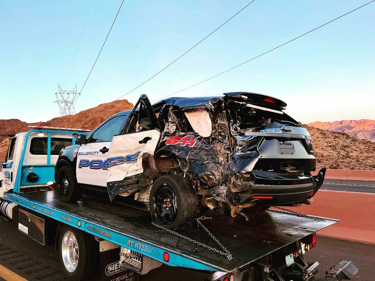 A Boulder City police officer suffered minor injuries after another driver crashed into the off ...
