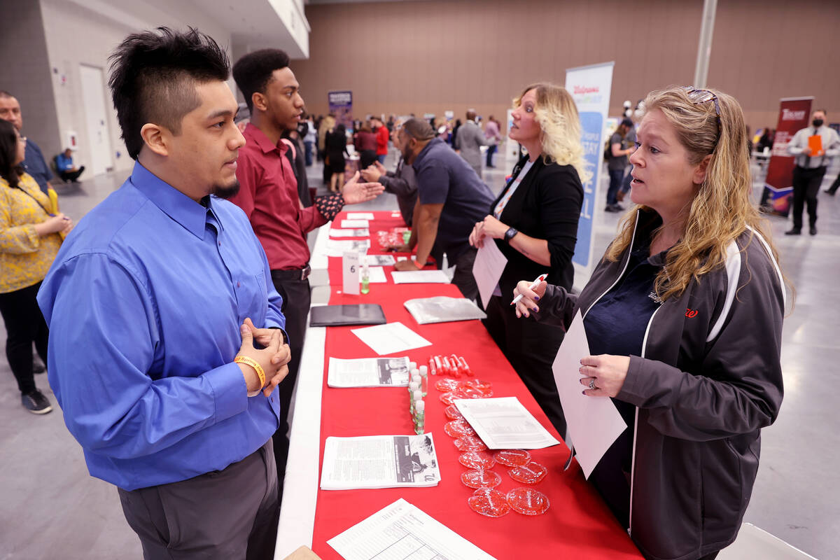 Christian Saldivar, 28, talks to Walgreens store manager Cathy Agundez during the Spring Job Fa ...