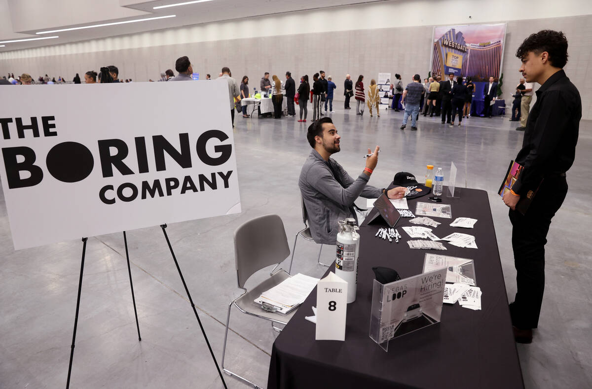 Mark DeWeese with The Boring Company, left, talks to Andre Villarreal during the Spring Job Fai ...
