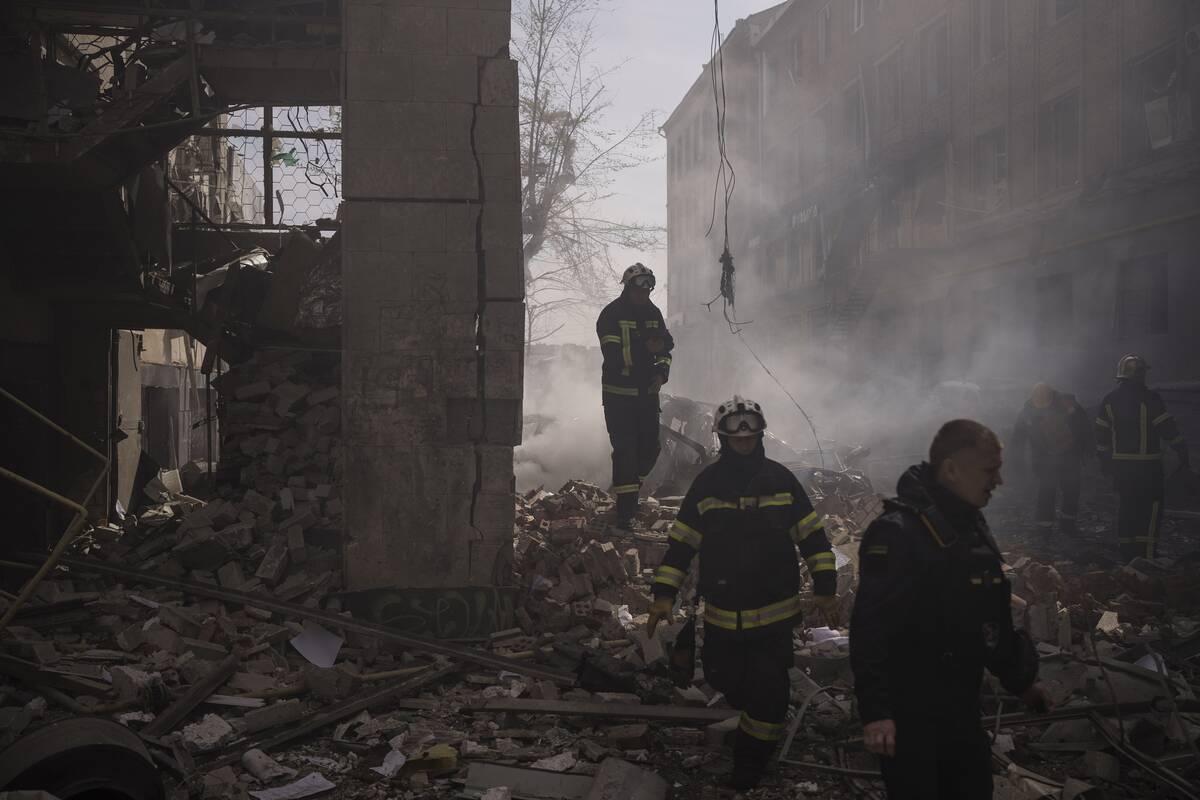 Firefighters work to extinguish multiple fires after a Russian attack in Kharkiv, Ukraine, Satu ...