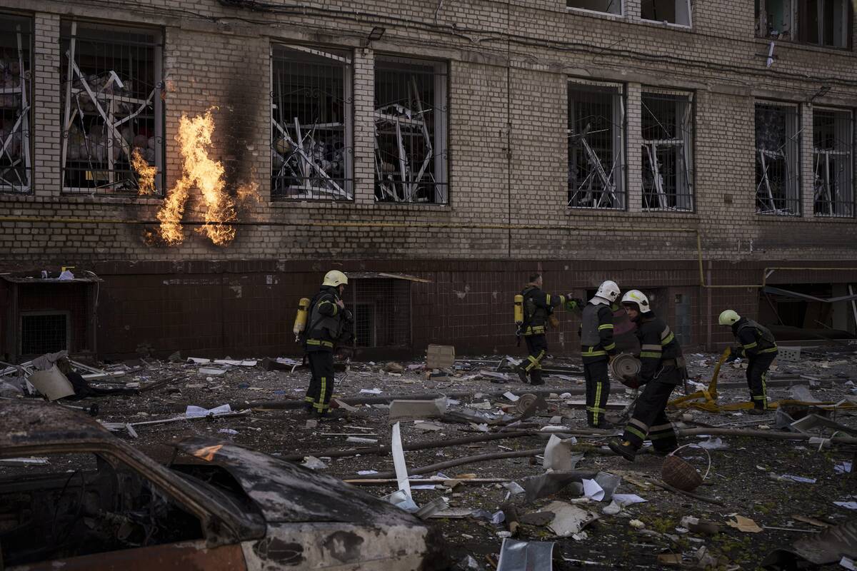 Firefighters work to extinguish multiple fires after a Russian attack in Kharkiv, Ukraine, Satu ...