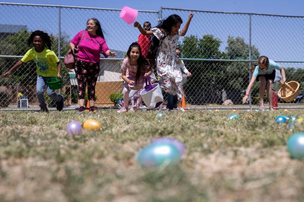 Children begin the Egg-Apalooza Easter egg hunt at the Paradise Recreational Center on Saturday ...