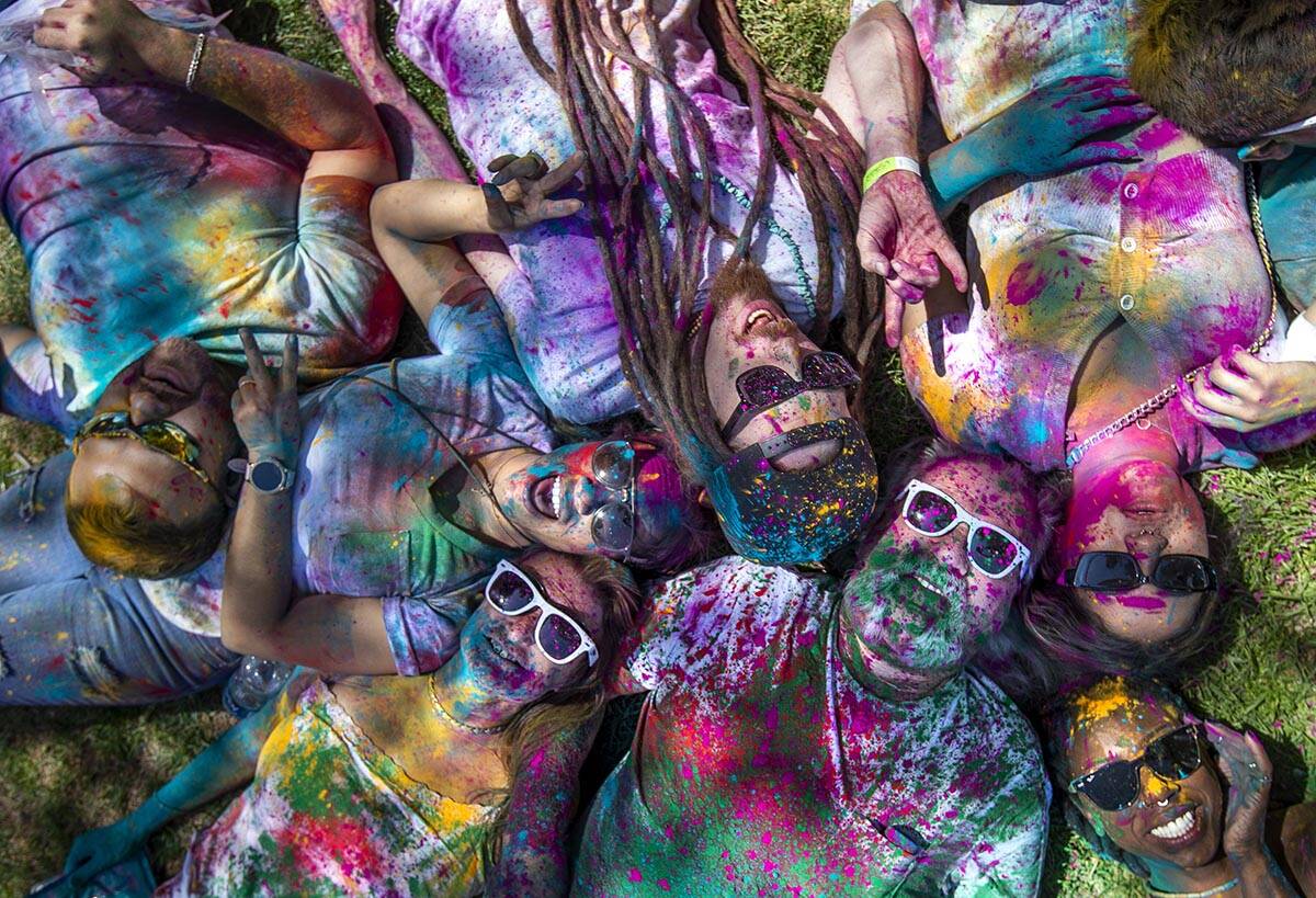 Friends and family gather together after throwing some colors during the Holi Festival of Color ...