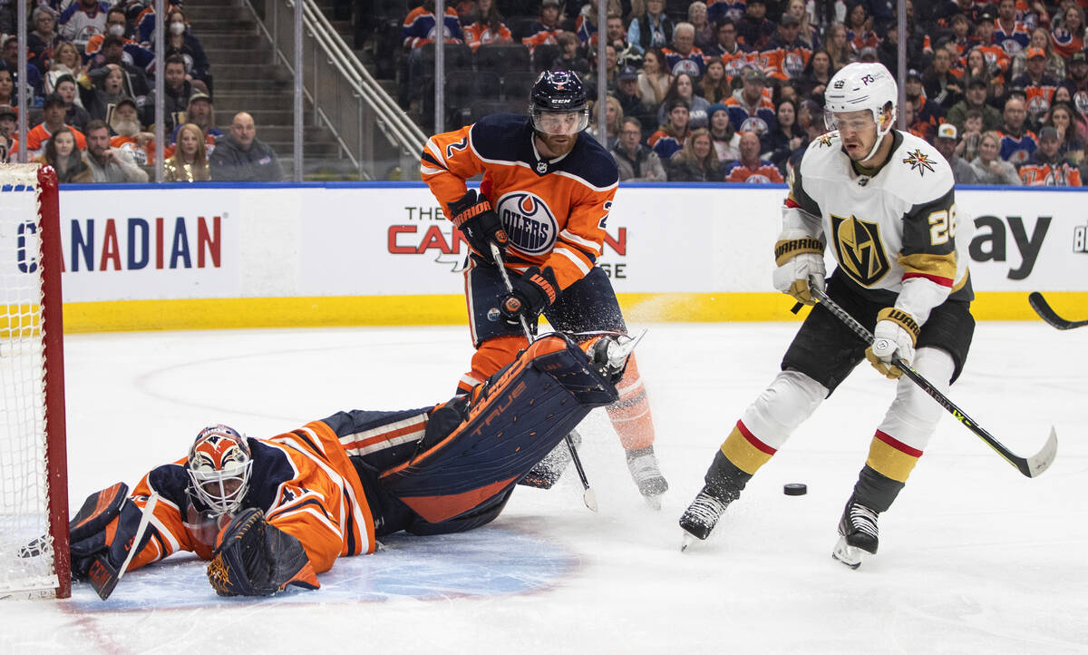 Vegas Golden Knights' Mattias Janmark (26) is stopped by Edmonton Oilers' goalie Mike Smith (41 ...