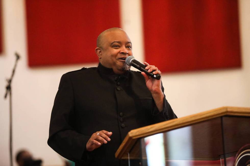 The Rev. Sean Taylor delivers a sermon for the Easter service at Victory Missionary Baptist Chu ...