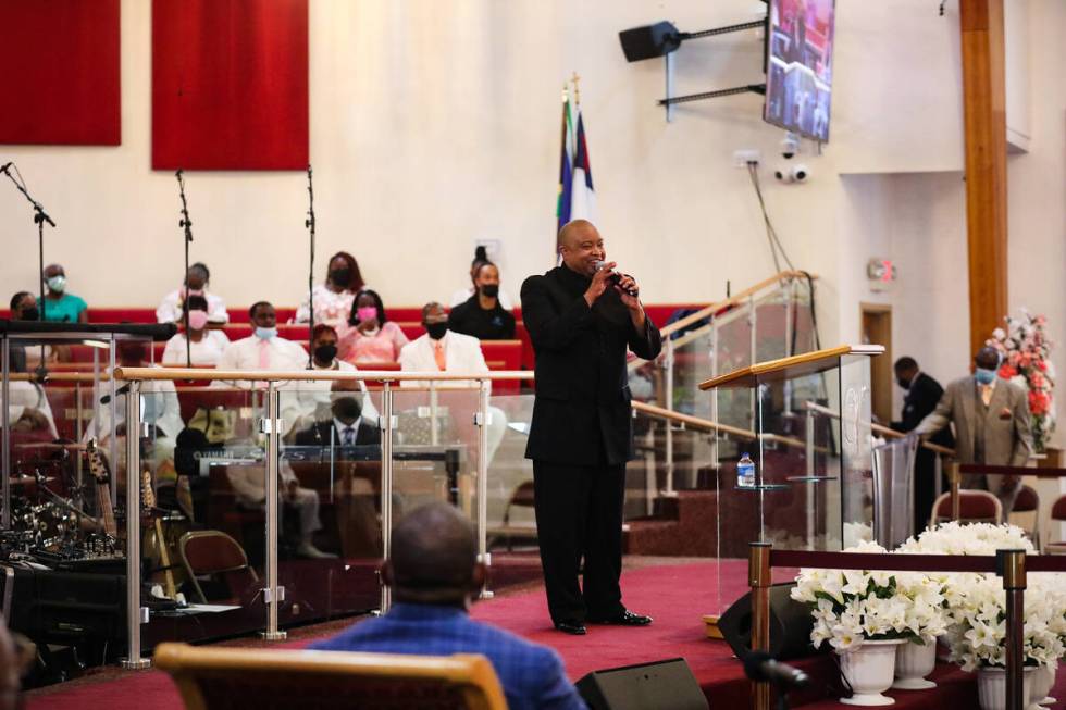 The Rev. Sean Taylor delivers a sermon for the Easter service at Victory Missionary Baptist Chu ...