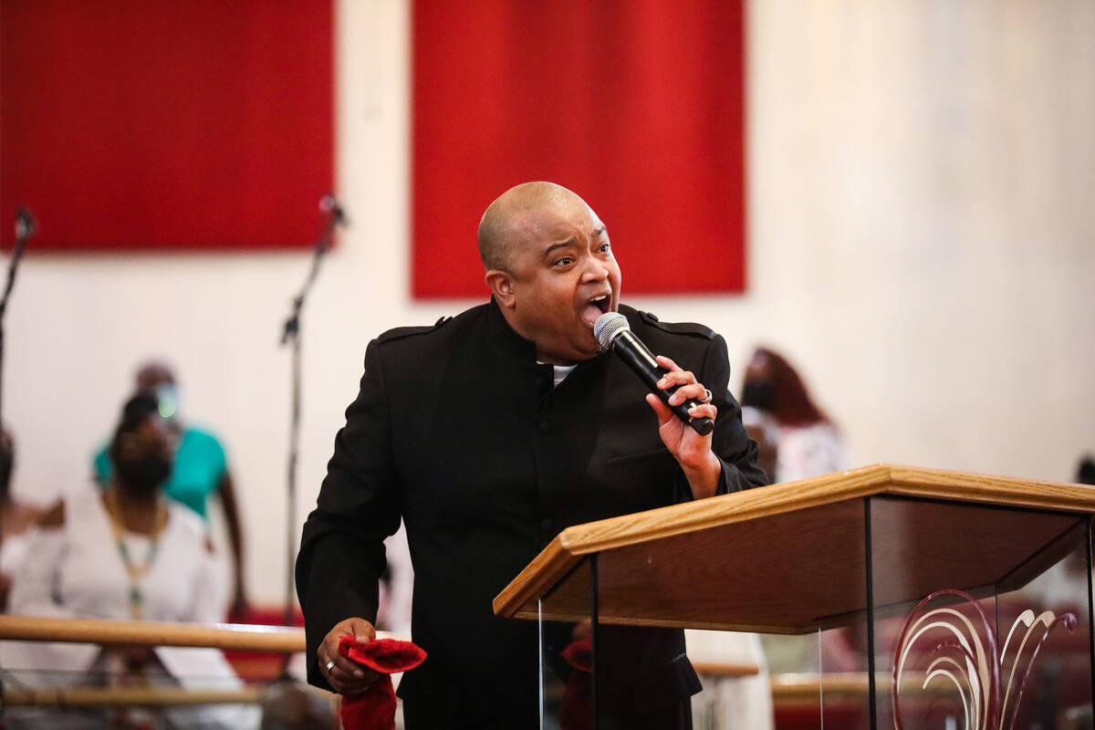 The Rev. Sean Taylor delivers a sermon for the Easter service at Victory Missionary Baptist Chu ...