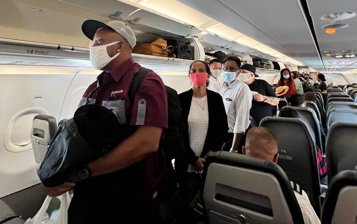 Passengers board a Frontier Airlines flight bound for Las Vegas on Monday, April 18, 2022, at D ...