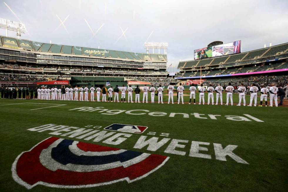 The Oakland Athletics line up on the baseline before a baseball game against the Baltimore Orio ...