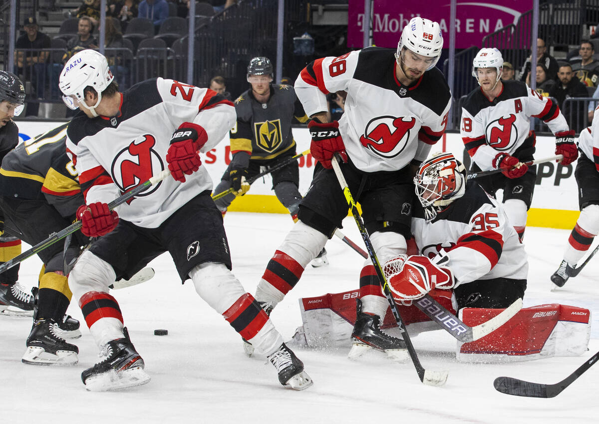 New Jersey Devils goaltender Andrew Hammond (35) tries to make a save in traffic in the third p ...