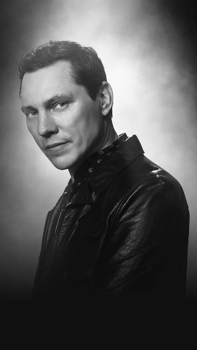 Tiësto is shown in a promotional shot for his upcoming residency at Zouk Nighclub and Ayu Dayc ...