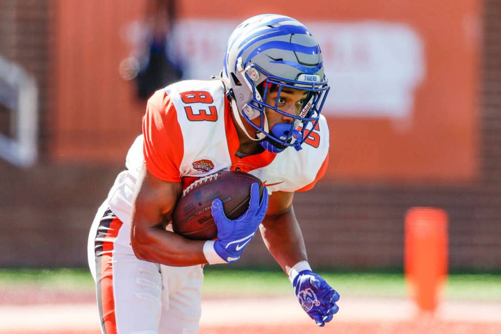 American Team wide receiver Calvin Austin III, of Memphis, returns the opening kickoff in the f ...